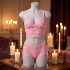 Blush Affair pink lace bralette and matching shorts set in a candlelit setting